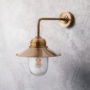 Plover IP44 wall light in antique brass