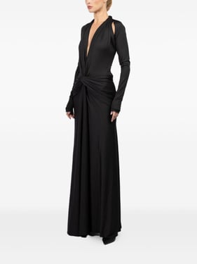 Long dress in black stretch jersey with V-neck and draped waist.