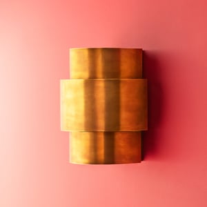Dorsey wall light in antique brass finish