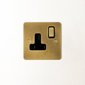 Lucian single socket with black inserts in aged brass