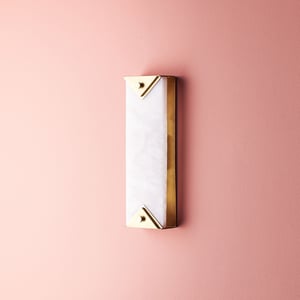 Theano wall light in alabaster and brass finish