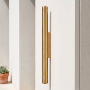 Portleven IP65 wall light in aged brass