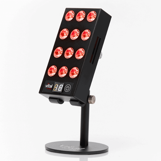 Black LED panel with 12 red lights on a stand, featuring control buttons and a digital display.