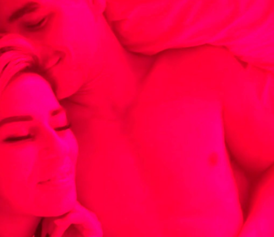 A couple sleeping while using Vital Red Light to regulate circadian rhythm