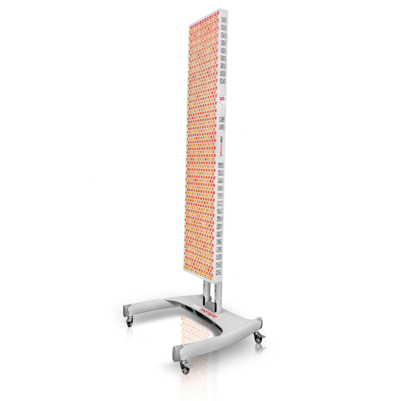 Vital Red LIght. Red Light Therapy. A tall, rectangular LED light therapy panel on a wheeled stand, emitting red and near-infrared light.