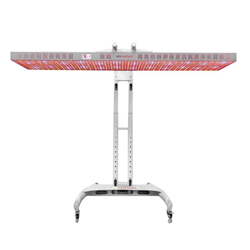 Vital Red LIght. Red Light Therapy. A large, adjustable LED red light therapy panel on a wheeled stand, emitting red and near-infrared light, viewed from the front.