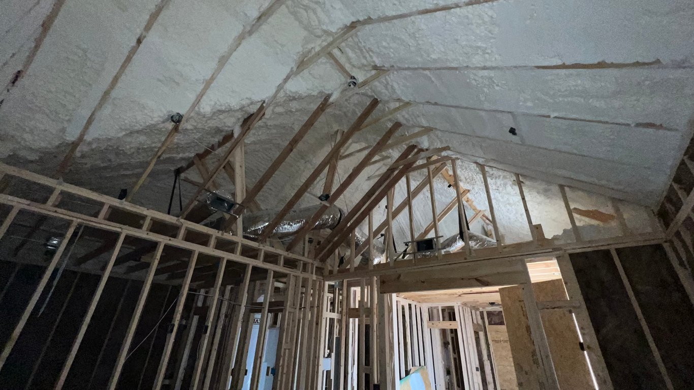 Foam attic insulation to reduce heat loss.