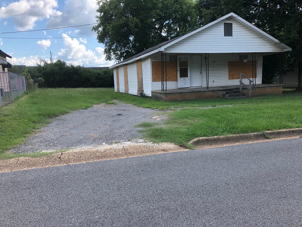 Boarded up property.