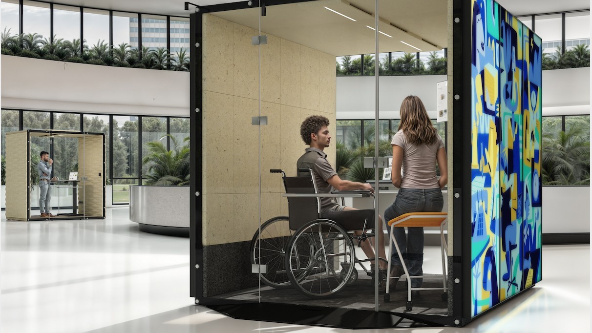 TechDogs-"Image Of Modern Inclusive Workspace Pod With A Person In A Wheelchair And Another Seated At A High Table Having A Conversation"
