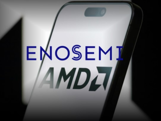 TechDogs-"AMD Doubles Down on AI Hardware With Enosemi"-"ENosemi And AMD Logos Reflected On Smartphone Screen Representing Acquisition"