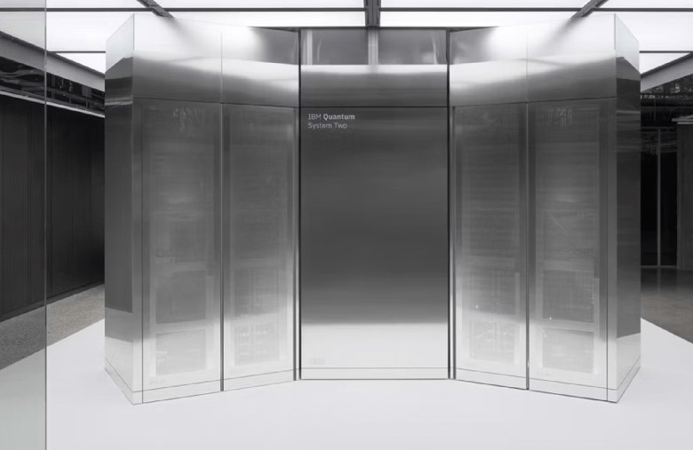 TechDogs-"What Did IBM Announce?"-"Quantum System Two, A Sleek, Futuristic Quantum Computer Housed In A Reflective Metallic Structure, Located In A High-tech Research Facility."