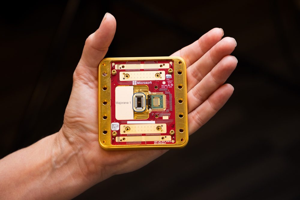 TechDogs-"An Image Of Microsoft's Majorana 1 Chip As Compared To A Human Hand"