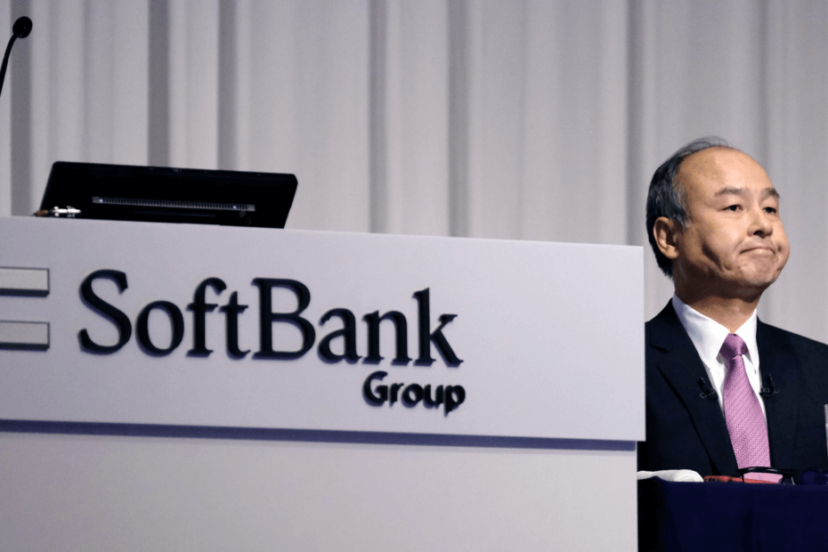 TechDogs-"An Image Of Masayoshi Son, SoftBank Group’s Founder And CEO, Alongside SoftBank Group's Logo"