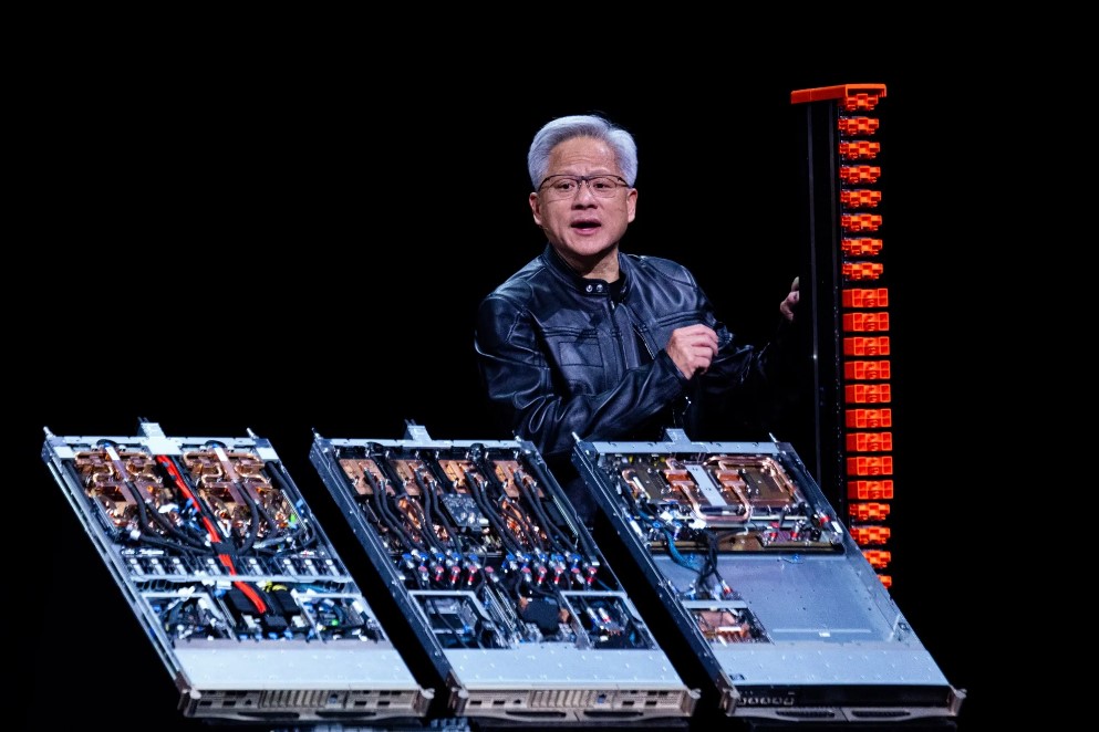 TechDogs-"Nvidia Launches NVLink Fusion To Stay Ahead In AI Chip Race"-"Nvidia CEO Jensen Huang Unveils AI Hardware at Computex 2025 Stage."