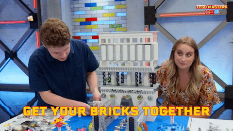 TechDogs-""Get Your Bricks Together" - LEGO Masters GIF With Two Contestants Building A Structure"
