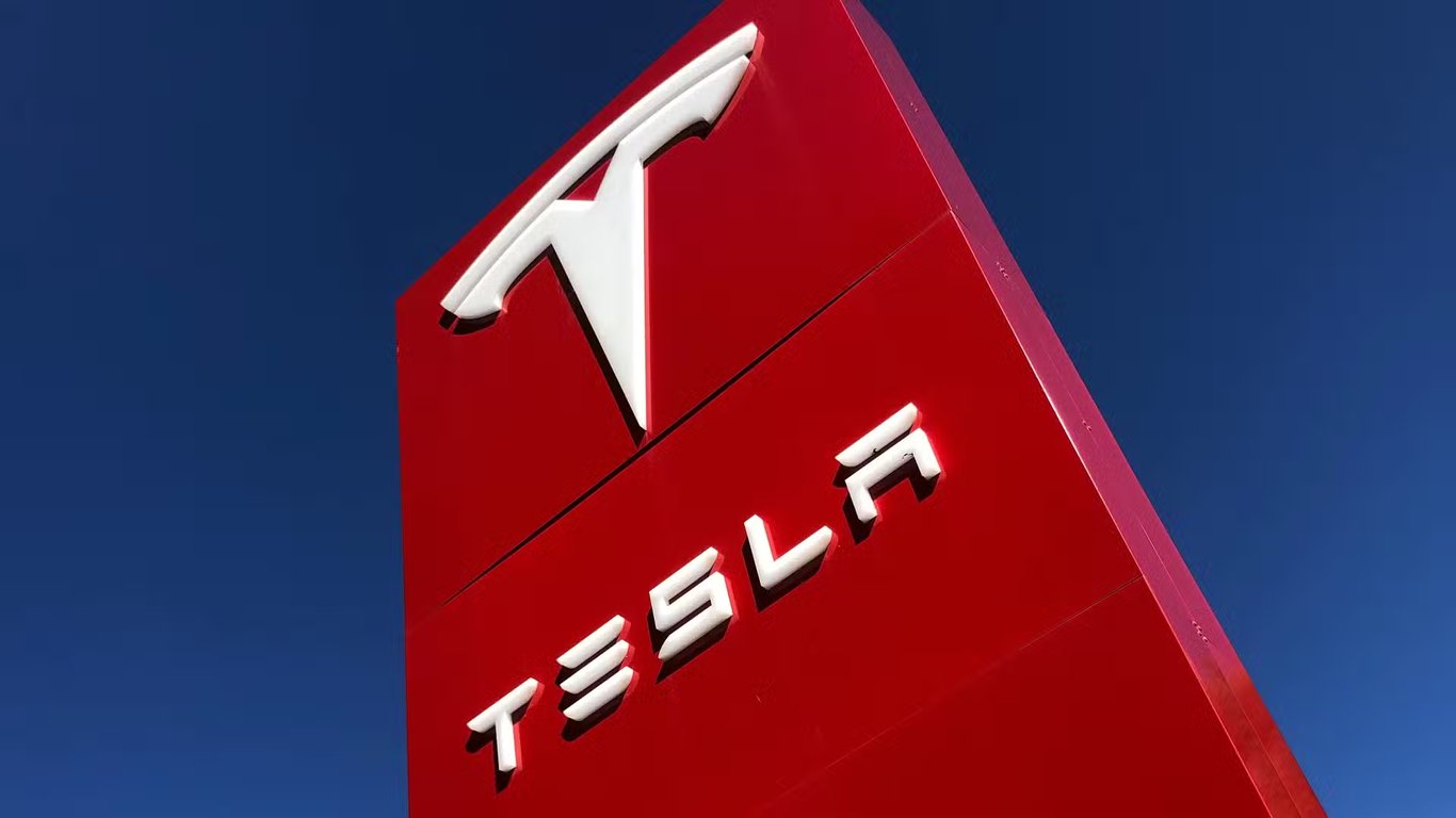 TechDogs-"An Image Of Tesla's Logo On A Board"