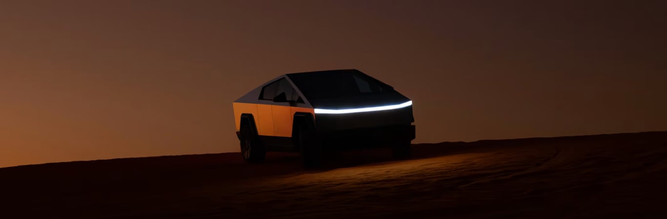 TechDogs-"An Image Of A Cybertruck Climbing A Sand Dune"