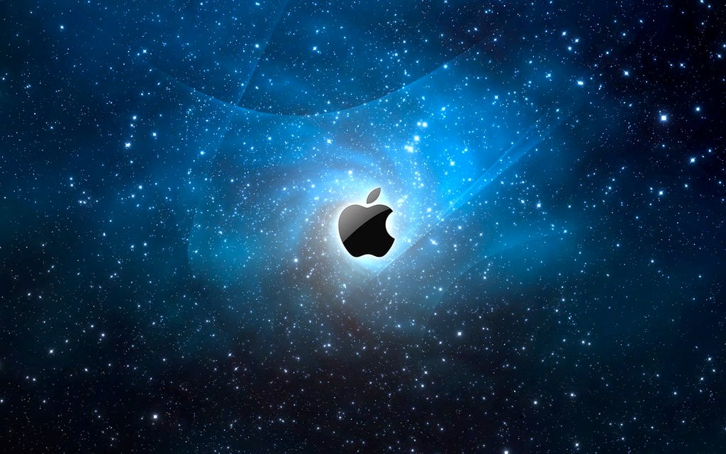 TechDogs-"An Image Of Apple's Logo Offset To A Space Background"