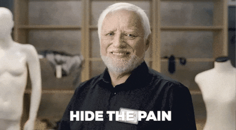 TechDogs-"What Is Ergonomics 2.0?"-"GIF Of Older Man Smiling Awkwardly In A Showroom, Representing Discomfort Masked As Contentment, Commonly Known As The 'Hide The Pain Harold' Meme"