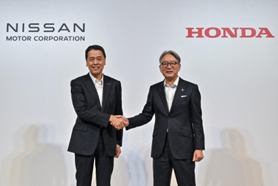 TechDogs-"What Are Honda And Nissan Planning?"-"Executives From Nissan And Honda Shaking Hands Announcing Potential Merger To Strengthen EV Market Competitiveness"