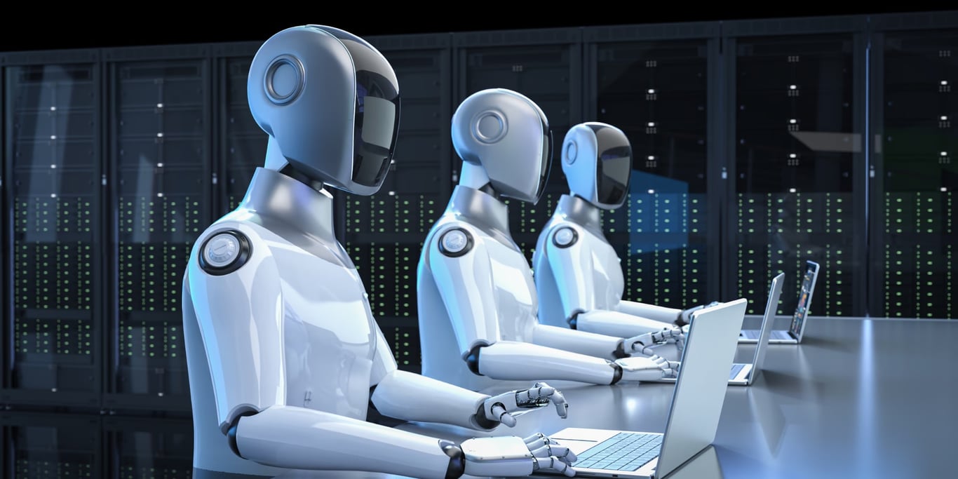 TechDogs-"Workers Lose Their Sense Of Purpose As Robots Take Over Tasks"-"An Image Showing Robots Working On Laptops"