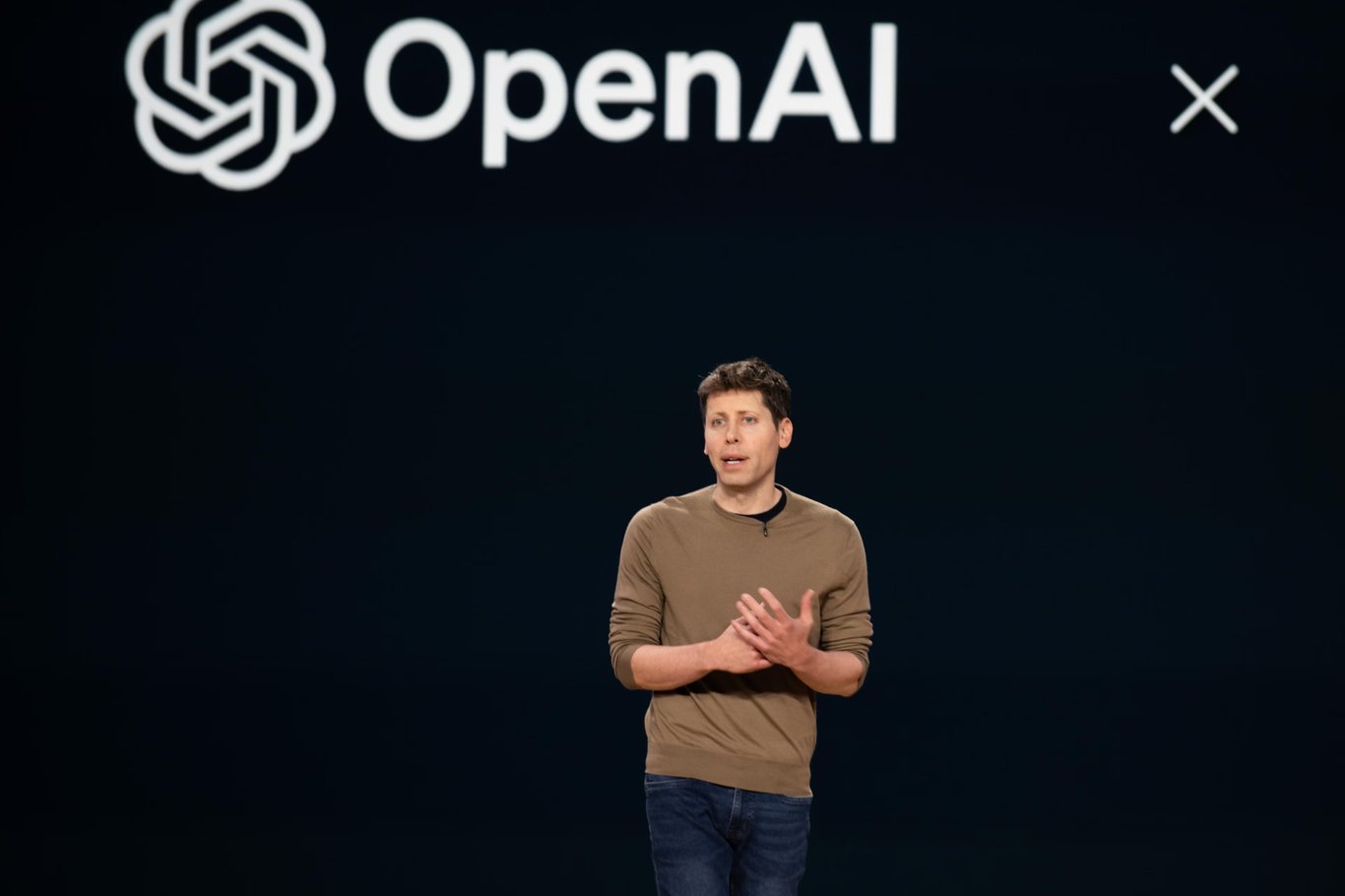 TechDogs-"An Image Of OpenAI's CEO Sam Altman And The Company Logo"