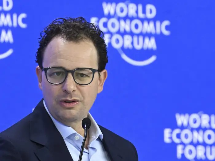 TechDogs-"Is AI Coming for Entry-Level Jobs? Anthropic’s CEO Thinks So!"-"Anthropic CEO Speaking At World Economic Forum With A Blue "World Economic Forum" Backdrop"