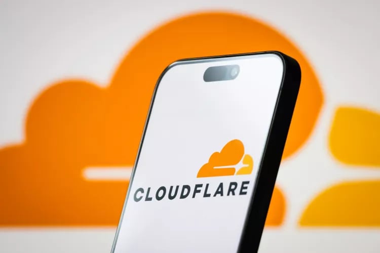 TechDogs-"An Image Showing Cloudflare Logo On A Phone"