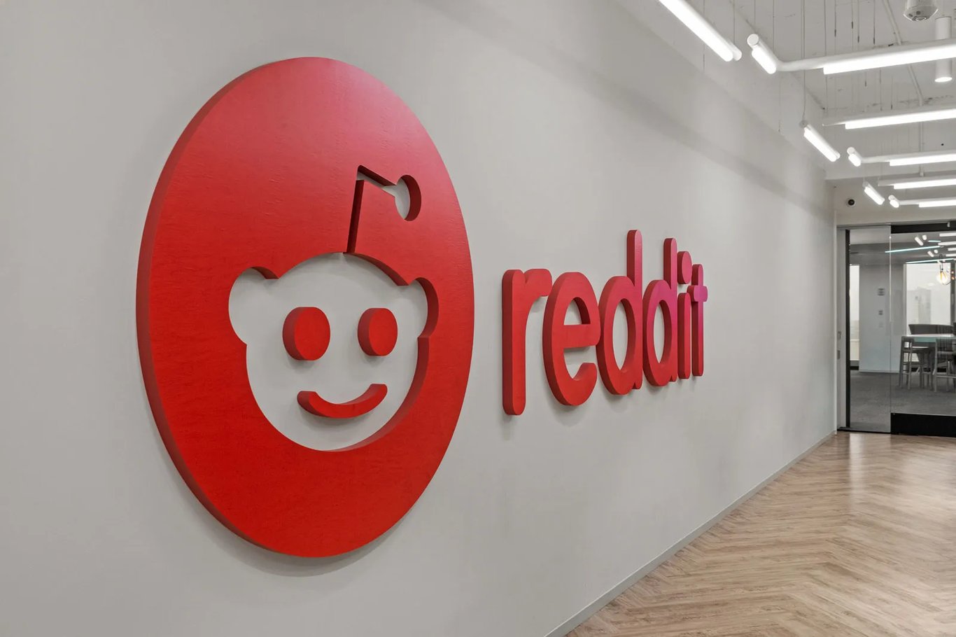 TechDogs-"An Image Showing Reddit Logo In The Hallway Of New York City Office"