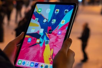 TechDogs-"WhatsApp Arrives On iPad With Enhanced Multitasking"-"An Image Showing A Person Holding An iPad"