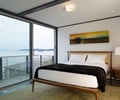 Preview of 56 Piles - Image 2: Bedroom, Indoors, Interior Design, Room, Bed, Furniture, glass exterior, balcony.