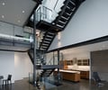 Preview of 56 Piles - Image 8: Apartment, Building, Housing, Indoors, Loft, Interior Design, Kitchen, Room, Airport Terminal, Terminal, staircase, steel stair, structural steel, concrete block, glass interior.