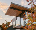 Preview of Ainslie Remodel and Addition - Image 0: cantilever, glass railing, wood ceiling, modern architecture, outdoor balcony, metal frame, cantilevered roof, glass wall, minimalist design, contemporary design.