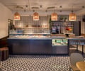 Preview of Anar - Image 0: Chair, Furniture, Blackboard, Luggage, Suitcase, Diner, Food, Meal, Restaurant, Couch, tile floor, steel counter, display.