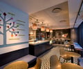 Preview of Anar - Image 1: Chair, Furniture, Dining Table, Table, Restaurant, Cafe, Indoors, Interior Design, tile floor, display counter, polysorb ceiling.