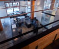 Preview of Architects Office - Image 4: Dining Table, Furniture, Table, Lathe, Machine, Building, Office Building, meeting space, office, concrete floor, steel tables, structure wood, interior glass, glulam, mezzanine, lighting.