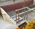 Preview of Arnstein Courtyard - Image 1: Wood, Flora, Plant, Vase, Handrail, entry, concrete wall, ipe fence, concrete steps.
