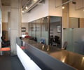 Preview of Attorneys Office - Image 2: Furniture, Reception, Reception Desk, Table, Conference Room, Indoors, Meeting Room, Room, interior glass, structure concrete, steel counter, exposed duct.