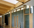 Preview of Bruckner Residence - Image 1: Door, Folding Door, structure wood, wood ceiling, concrete wall, skylight, concrete floor.