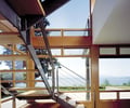 Preview of Bruckner Residence - Image 9: Dining Table, Furniture, Table, Canopy, steel stair, exterior glass, handrail.