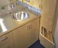 Preview of Cascades Lakehouse - Image 11: Drawer, Furniture, Indoors, Interior Design, Kitchen, Room, Sink, Plywood, Wood, wood cabinets, stainless steel countertop, bathroom.