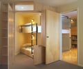 Preview of Cascades Lakehouse - Image 12: Indoors, Interior Design, bedroom, bunkbed, wood cabinets.