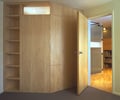 Preview of Cascades Lakehouse - Image 13: Flooring, Door, Sliding Door, Closet, Cupboard, Furniture, Floor, wood cabinets, bedroom.