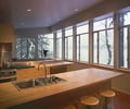 Preview of Cascades Lakehouse - Image 6: Bar Stool, Furniture, Window, Indoors, Interior Design, Dining Room, Room, wood cabinets, exterior glass, waterfront, kitchen, wood countertop.