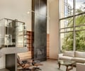 Preview of Davidson Condominium - Image 3: Coffee Table, Indoors, Great room, Hearth, Fireplace, Steel, Glass, Window, Couch, Furniture, Staircase.
