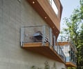 Preview of Dellplain Residence - Image 7: Window, Walkway, Balcony, House, High Rise, Flora, Concrete, Wood, Steel, Glass, Pavers.