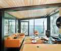 Preview of Ehab - Image 7: Couch, Furniture, Steel, Structure Steel, Wood, Carpet, Glass, Window, Waterfront, Fireplace, Living Room, House, Deck, Glass Door, Interior Design, Indoors, Indoor, Concrete floor, Glass exterior, Structure steel, Color.