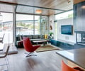 Preview of Floating Home - Image 15: Chair, Furniture, Bench, Apartment, Building, Housing, Indoors, Loft, Dining Room, Interior Design, Room, Fireplace, Indoor, Waterfront, Wood floor, Wood ceiling, Exterior glaass, Steel wall.