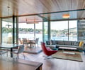 Preview of Floating Home - Image 16: Couch, Furniture, Dining Table, Table, Chair, Great room, Building, Housing, Indoors, Loft, Interior Design, Living Room, Room, Wood ceiling, Wood floor, Indoor, Waterfront, Exterior Glass.