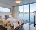Preview of Floating Home - Image 22: Bedroom, Indoors, Interior Design, Room, Bed, Furniture, Waterfront, Concrete floor.